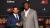 Alumnus Rajinder Tumber shaking hands with boxer Lennox Lewis