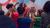 Group of people dancing and clapping