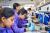 Students using an inverted microscope