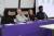 Panellists sitting at desk