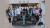 Students standing around an Aston Martin F1 car