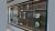 Trophy case displaying trophies and helmets at the Aston Martin F1 headquarters in Silverstone