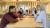 Students talking around a table in the Marylebone campus library group study space
