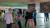 Picture of students looking at the projects on display at the Architectural and Environmental Design exhibition.