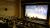 A photo of the panellists in front of the cinema screen from in the stands. 