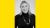 Black and white image of Caron Bradshaw bordered by yellow stripes.