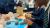 A group of students are making models of the brain out of clay.