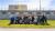 Picture of students posing for a group photo outside of a prison on the criminology trip.