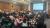 Photo of attendees sitting in small groups discussing research questions to address evidence gaps in youth transitions.