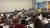 A picture of a crowded lecture room watching Yanis Varoufakis, Jeremy Corbyn and Melissa Benn on a panel.