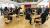 Colleagues networking around tables. 