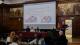 Picture of audience members listening to the speakers at the DEN conference.