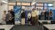 Westminster gene editors stand in front of banners for the event.