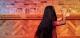 A girl with long black hair dancing