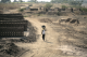 A man walking through an Indian village 