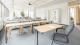 Empty classroom of desks and chairs with an overhead projector.