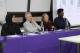 Panellists sitting at desk