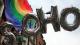 Soho spelled with balloons in front of a Pride flag