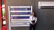Female student standing in front of IOM Headquarters in Geneva 
