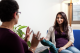 Image of a woman smiling at a counsellor