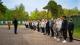Picture of students lined up and listening to a guide on a prison tour on the criminology trip.