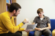 University of Westminster, Harrow Campus. A male, sitting on the left, talking to a male student sitting on the right