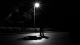 Figure in the dark in front of street light - Lacie slezak, Unsplash