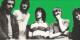 Black and white images of Fleetwood Mac rock band standing against a green background 