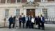 Students stand with Dr Frennhoff Larsen in front of the EU Delegation at Europe House.