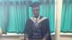 Student Henry Egbums in graduation gown