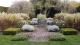 Compressed image of garden with shrubs in