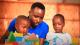 Man and two children playing with toys