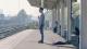 Man standing alone on station platform