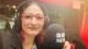 Professor Nitasha Kaul sat in the BBC radio studios with a microphone that says "BBC NEWS"