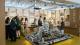 Picture of students looking at student projects on display at OPEN 2022.