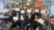 Group photo of the workshop attendees holding their certificates.