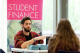 University of Westminster, Cavendish Campus Open Day 2014: a female student (back turned) talks to a male staff member at an information desk with a banner reading Student Finance