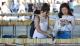 Two females at a book sale looking at books