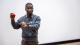 Sucesss Ajayi presenting while holding a red toy heart