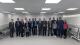 Group of Westminster staff stood in a line with Carlos and Marcelo in the middle