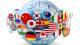 Stock image of a globe with flags of different countries wrapped around it.