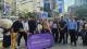 WWC students at Shibuya Crossing in Tokyo with a purple banner reading WESTMINSTER WORKING CULTURES