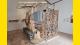 A photo of the main installation in the PART exhibition, which is made up of lots of different materials that can be found in ruins.