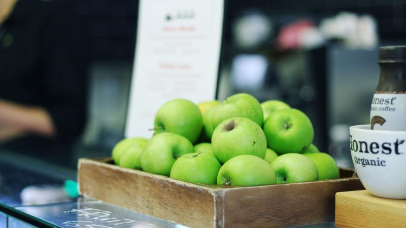 A bowl of apples on a countertop