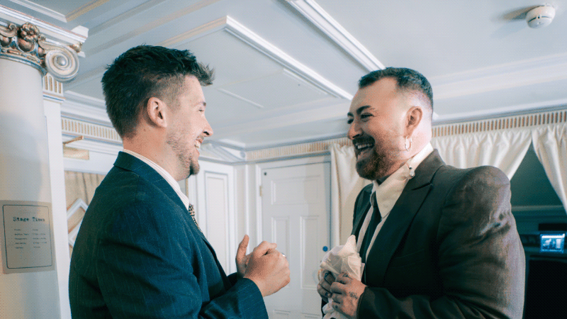 Westminster alumnus Bradley Jago speaking with singer Sam Smith