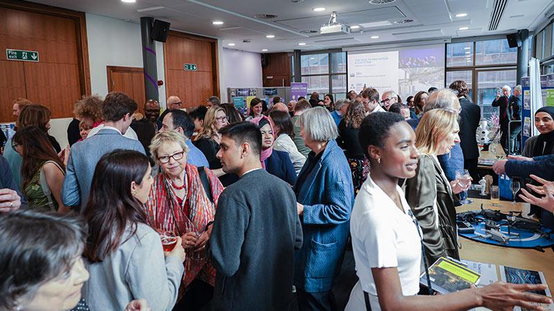 Crowd of guests networking at Quintin Hogg Trust Celebration event