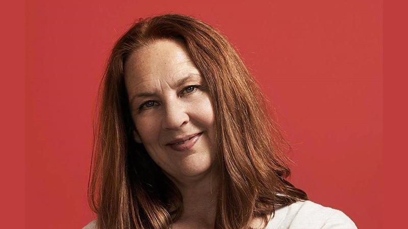 Headshot of Fiona O'Connor with red background