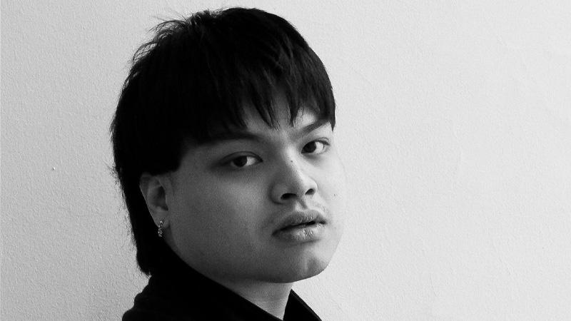 Black and white picture of Konthorn Wutthiwongangkhana looking into the camera.