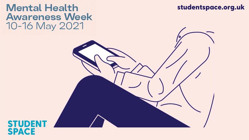 Student sat checking his phone
