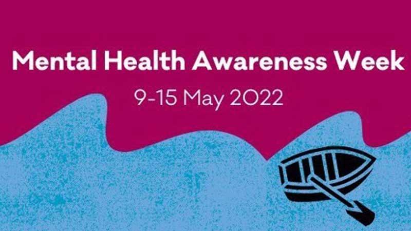 Mental health awareness Week text with small boat on river